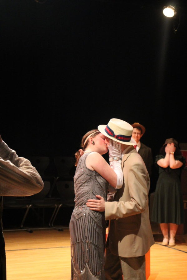 Characters Mortimer Mortimer (right) and Nelly Fail (left) kiss during dress rehearsal. Mortimer is played by senior Hayden Brite and Nelly is played by Lizzie Forrester.