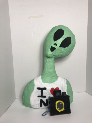 Senior Maggie Johnsons sculpture of an alien tourist made with paper mache.
