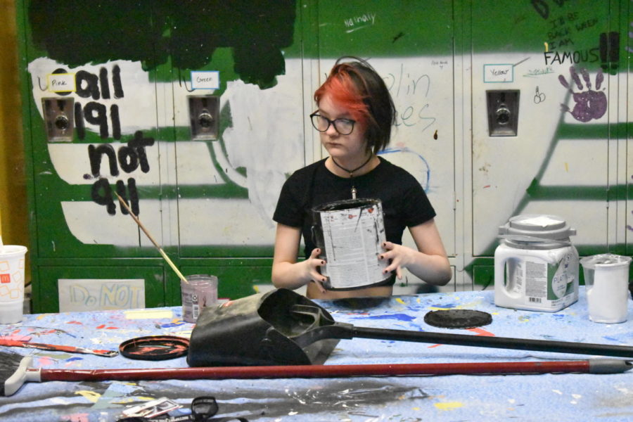 Senior Luka Maga prepares paint in Technical Theatre on Sept. 1. Currently, Technical Theatre is working on building props and stage sets for the fall musical.