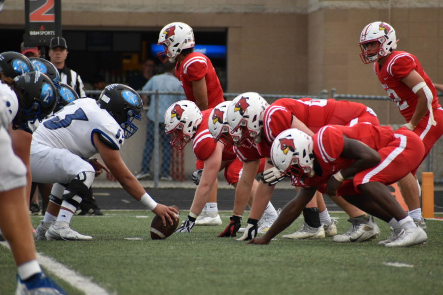 The Cards defensive line prepares for the Bulldogs to start the play. The Bulldogs won the game 47-14.