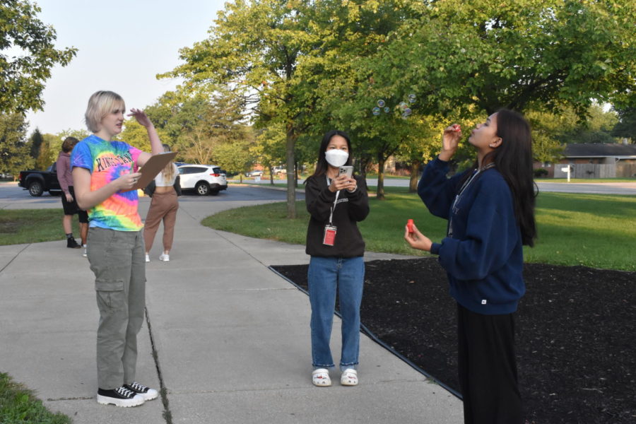 Juniors Esther Li, Rem Tial and Sophie Wiley in Rachel Brunsells A.P. Environmental Science class blow bubbles as part of a lab. The class used their bubbles to represent parental care in different populations.