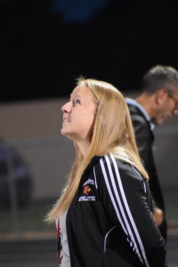 Assistant Principal Amy Boone looks out while in the stands at a home football game. Boone could be seen at many of the Cardss football games throughout the season.