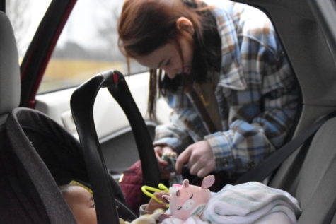 Former SHS student Brooklyn Ritter picks out toys for her baby Montéa to have in the car on Dec 15. She had picked up her daughter from the babysitter earlier.