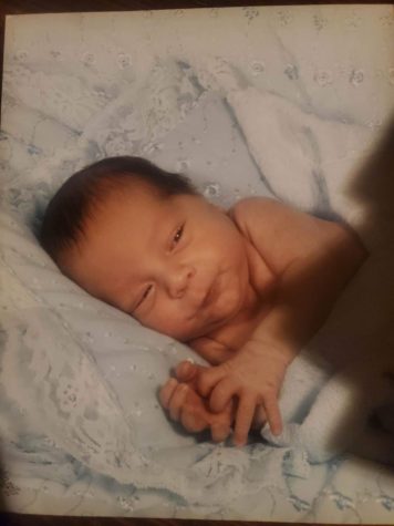 Current senior Carlos Tapscott lays on a blanket as a baby. contributed by Carlos Tapscott