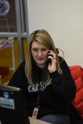 Librarian Shelly Smith talks on the phone during iPass  on Mar. 10 in the LMC. The space is open to students at this time.
