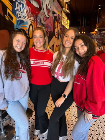 (left to right) SHS alumni Ellie Brown, Emma Meredith, Hope Reynolds, and Aryssa Ramos watched the IU vs Purdue basketball game at Yogis, a Bloomington restaurant, on Feb. 18. photo contributed by Hope Reynolds
