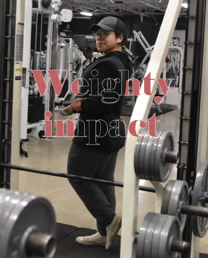 Senior+Brandon+Carreon+looks+at+himself+during+his+workout+on+May+13+at+American+Muscle+Factory.+Carreon+feels+most+confident+at+the+gym+when+he+has+a+pump.