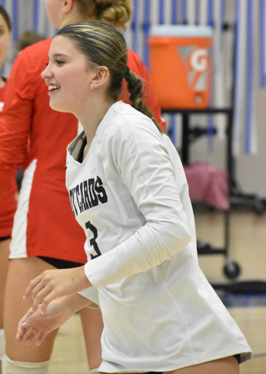 Junior Arianna Neese laughs during the SHS girls volleyball game against Perry on Monday, Sept. 11. At the end of the night, SHS beat Perry 3-1.