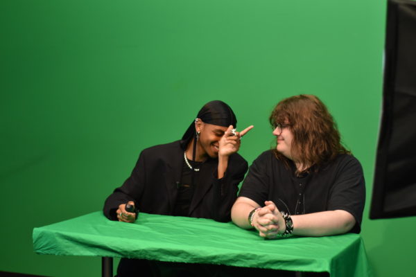 Junior Devyon Green and senior Kenneth Foxworthy smile while filming a scene for SPTV on Friday, Sept. 16. During class, the SPTV staff films and edits videos to be played during Ipass.
photo by Darcy Leber
