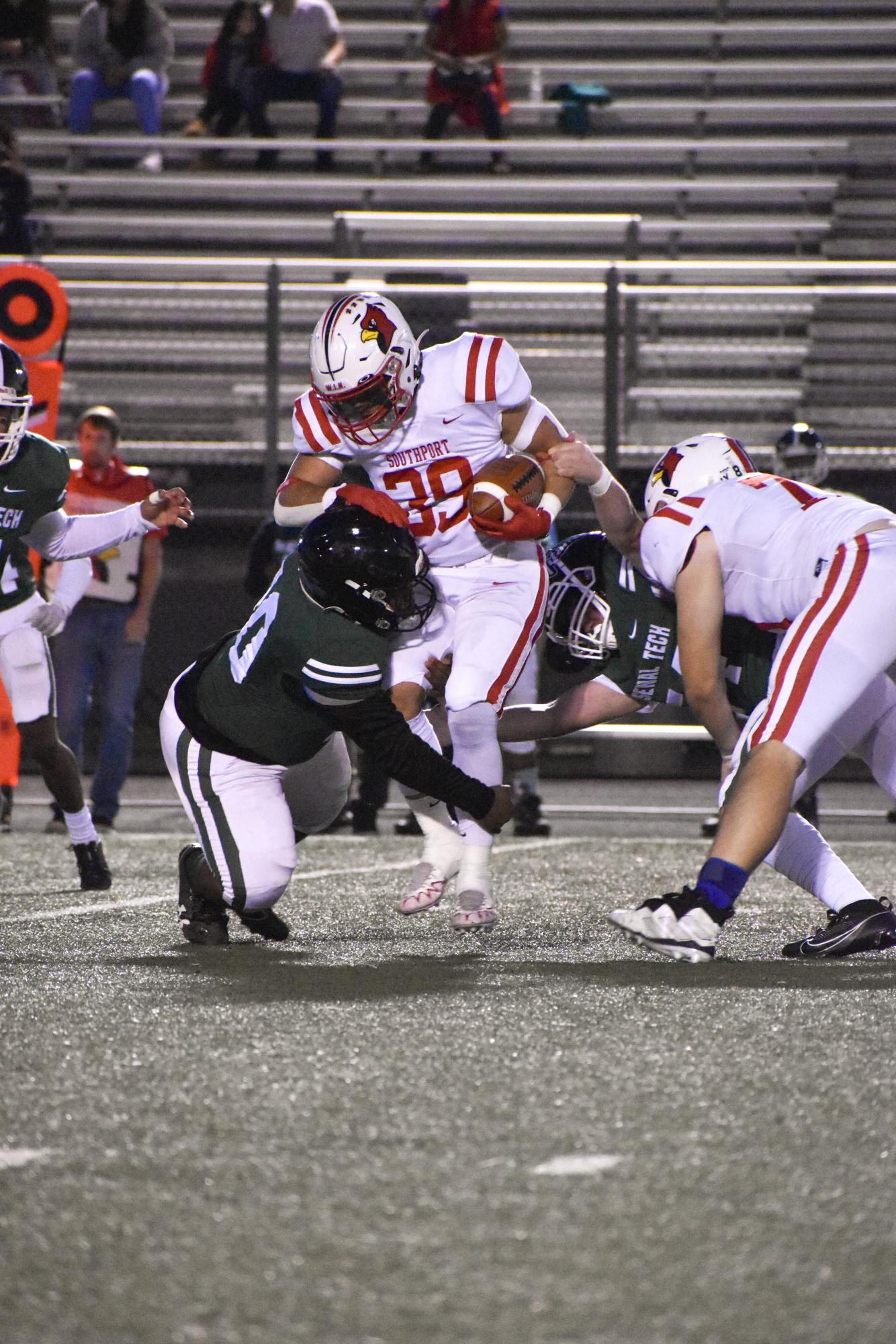 Sophomore Riley Matlock attempts to avoid a tackle against Techs defense.