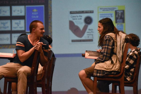 Senior Noah Daniel turns in his seat to talk to senior Annabelle Southern during their first scene together. photo by Darcy Leber