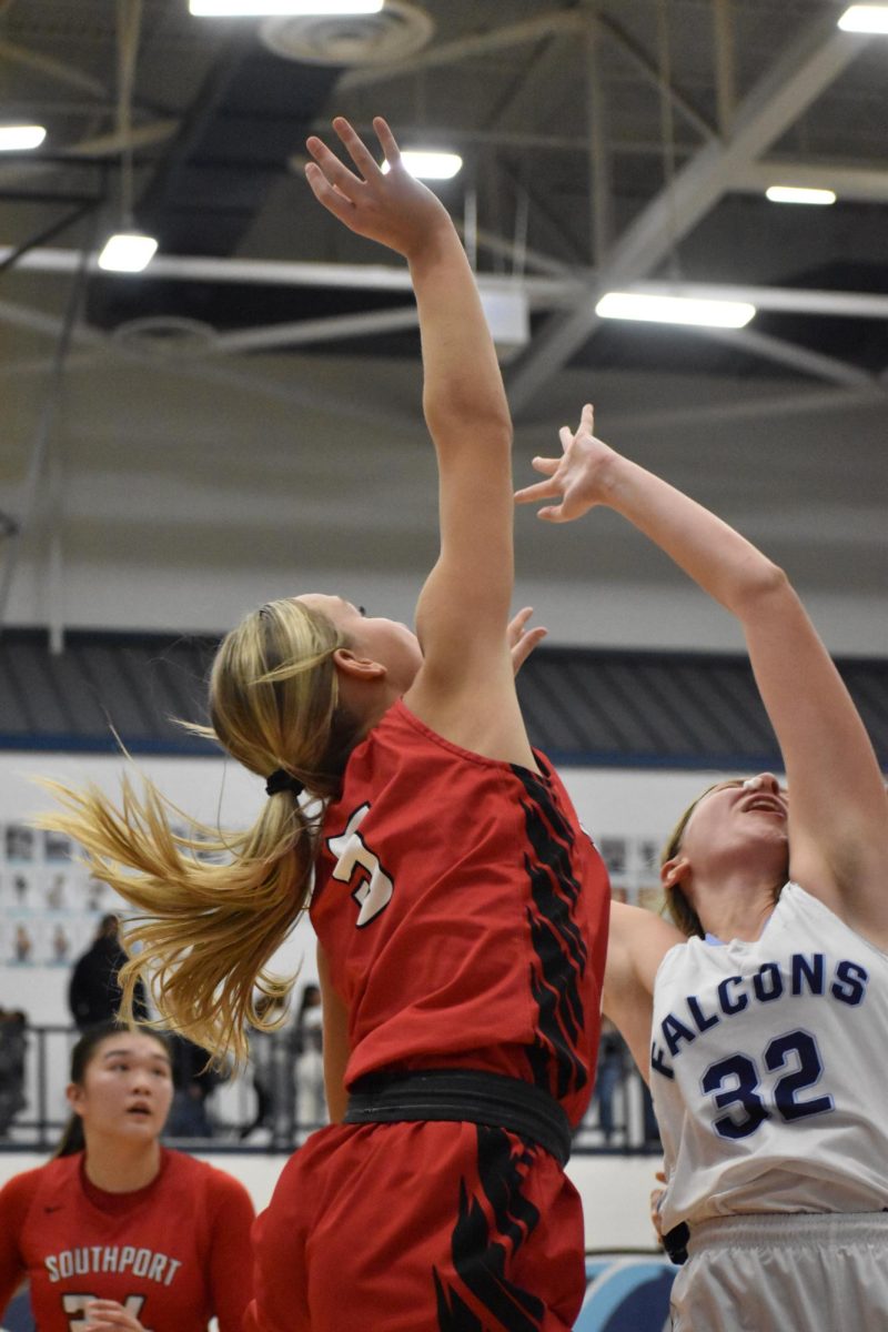 Senior+Josie+Miller+goes+for+a+layup+shot+during+the+girls+basketball+game+on+Nov.+21+at+Perry+Meridian+High+School.+The+Lady+Cards+lost+the+game+42-32.