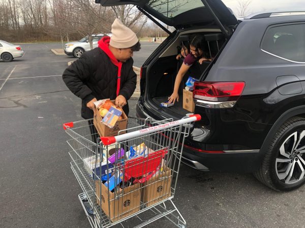 Partnering with the Chin Youth Organization of Indiana and the Great Harvest Food Pantry, the Southport International Rotary Club provides free groceries to the Burmese and Congolese community on Jan.20.  
Photo contributed by the Southport International Rotary Club Facebook