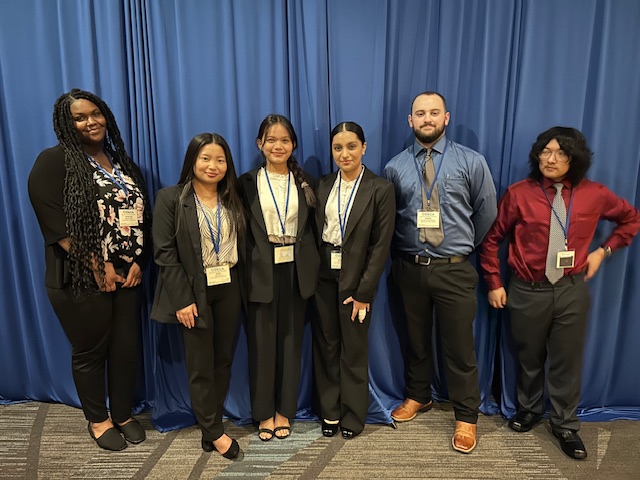 DECA members (from left to right) seniors Natalla’h Wilson, Mang Dim, Esther Li, Manprit Kaur, Donald
VanValkenburg
and sophomore Samson Nguyen competion on March 5. 
photo contributed by Ashley Quinlin 
