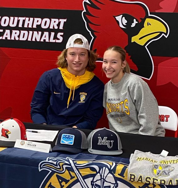 Calvin and Josie Miller smile together during Calvins signing.
