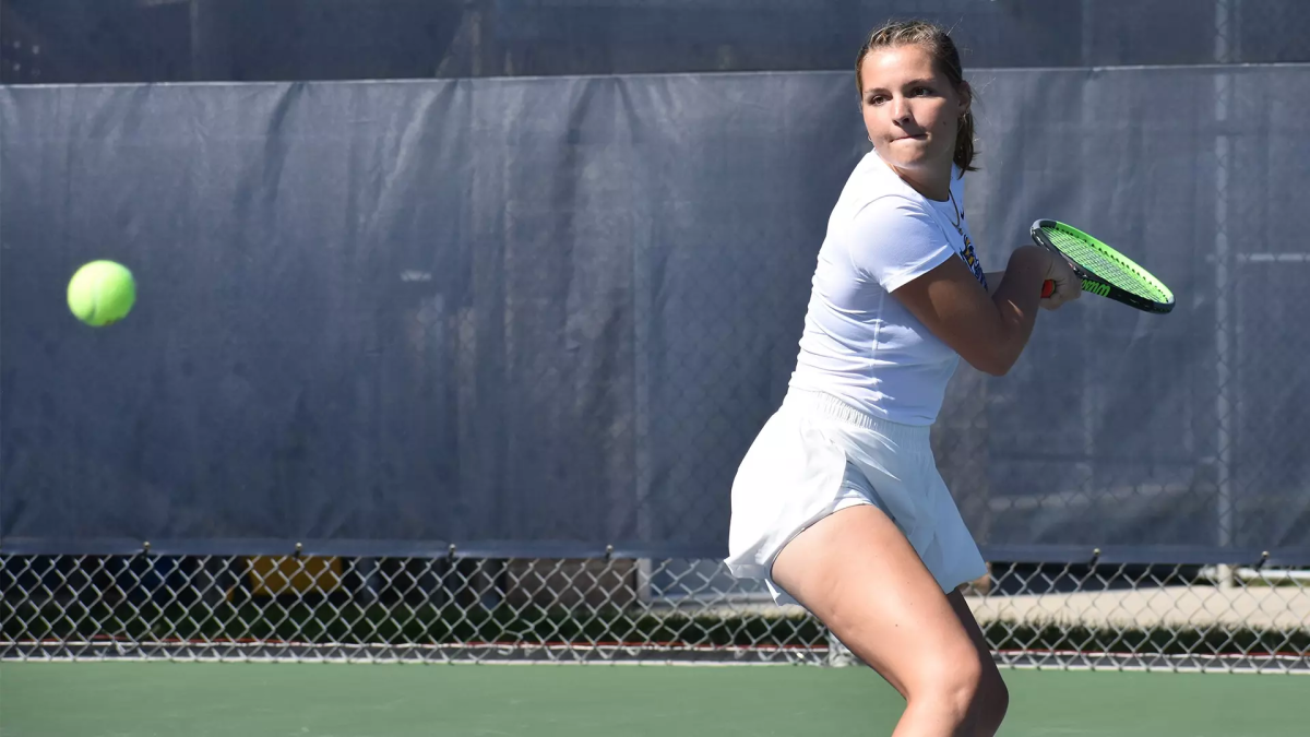 Josie Yarbrough goes for a backhand return. Yarbrough will be the new SHS boys tennis coach this fall. (Photo contributed by Marian Athletics)