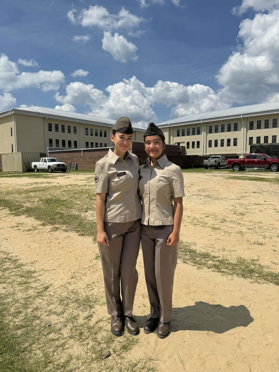 Senior Zamantha Loza-Barraza and her bunk mate say their last goodbyes in front of their company on graduation day on Aug.16. photo contributed by Zamantha Loza-Barraza
