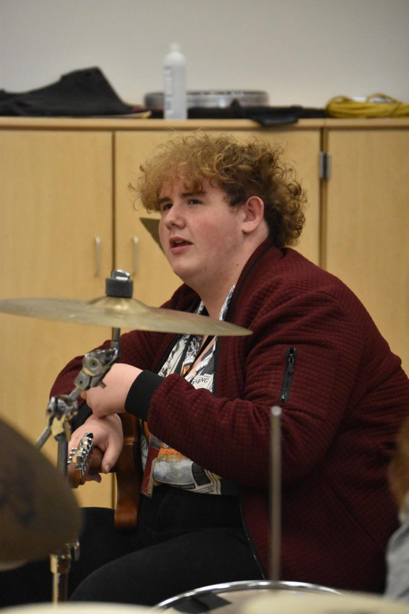 Mix discusses musical choices with his band. photo by Salem Ortega-Morales