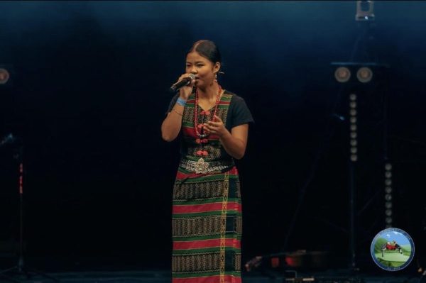 Senior Abisak Awi sings a Chin song on Saturday, Sept. 7 at the Chin New Year Festival. Awi is involved in many musical activities in her community one being the Praise & Worship team at her church.