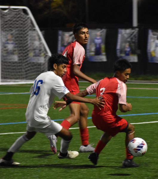 Junior Duhnin Rumlian prepares to pass the ball to Junior Misael Prado. The Cards defeated the Columbus North Bulldogs 5-2. (photo by Aiden Quinlin.) 