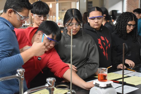 Students in Tejchma's sheltered class perform a lab on Tuesday Dec. 3rd. Students transitioned from the forensic science unit to learning about different types of heat transfer.