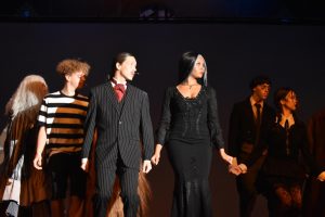 Natalee Rojas, Tristen Blakely, Andrew Schauer, Keyona Graham, Nienna Wittlief and Logan Goff practice their dancing and singing performance during their dress rehearsal Nov. 14 in the auditorium. Photo by Salem Ortega-Morales