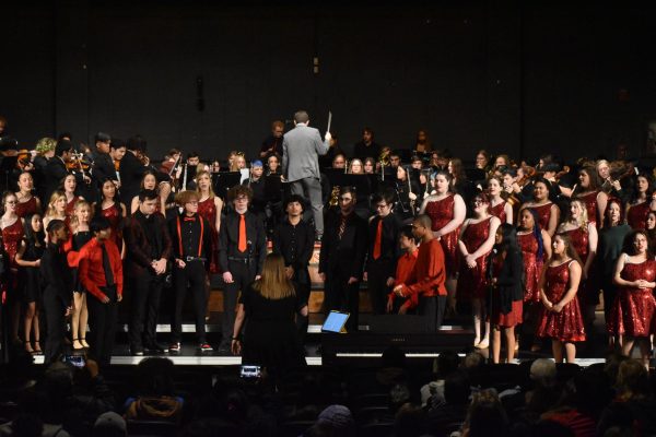 Band director Jeff Maupin conducts the program. All the advanced music groups performed together. photo by Kiley Bowman