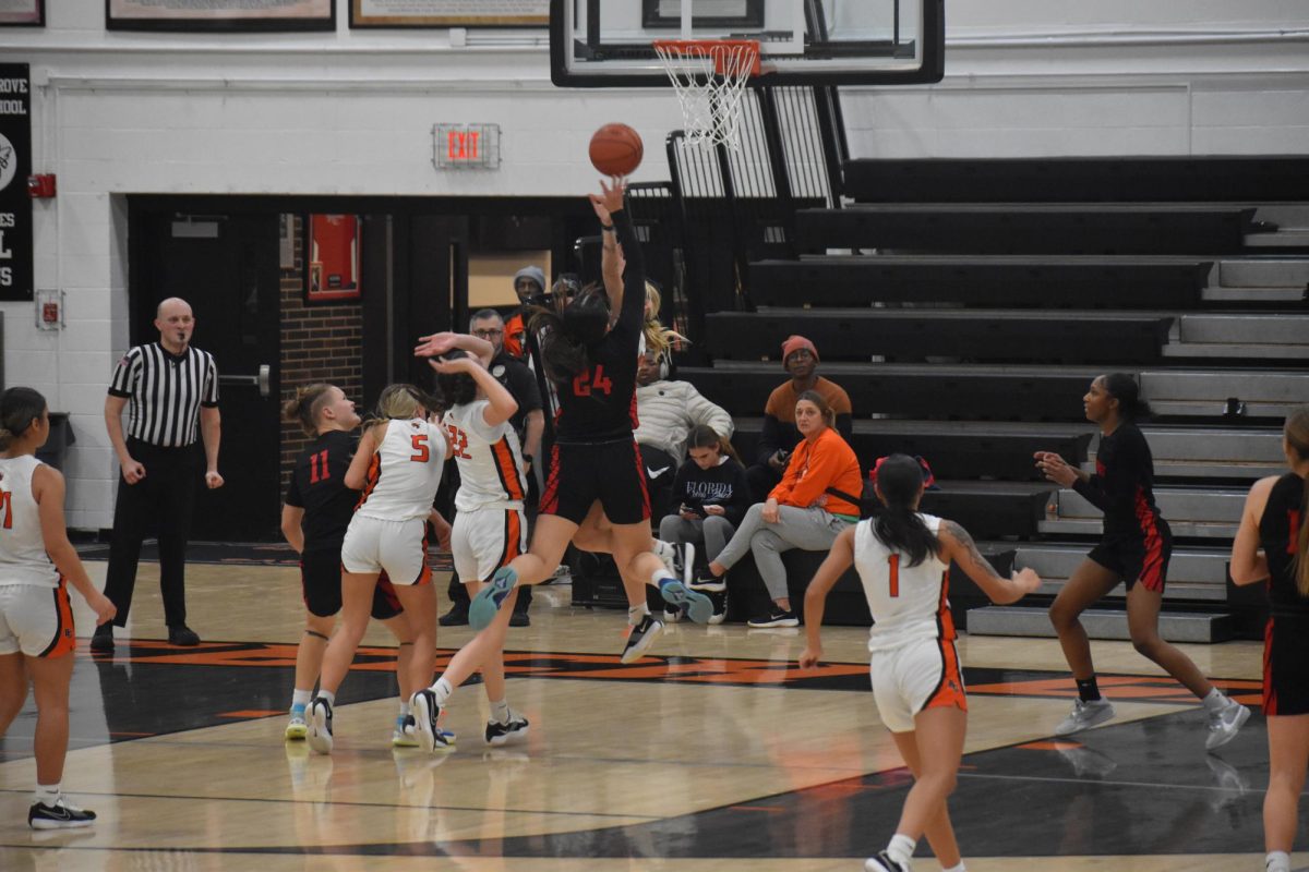 Senior Sophia Nguyen jumps to rebound the ball during an away game against Beech Grove on Thursday, Jan. 23. This game was special to Nguyen because her old travel basketball coach works for Beech Grove.