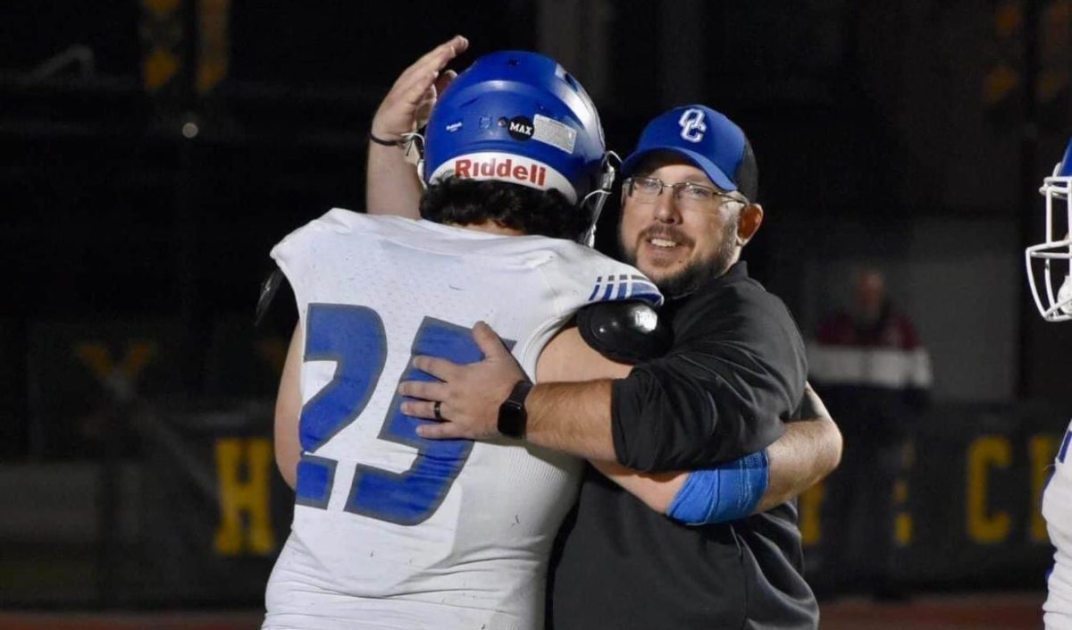 Head coach Sean Little hugs a player at his previous coaching job at Oldham County High School. Southport Athletics announced Sean Little was named the new head coach of SHS football on Monday, Jan. 13. (photo contributed by Sean Little)