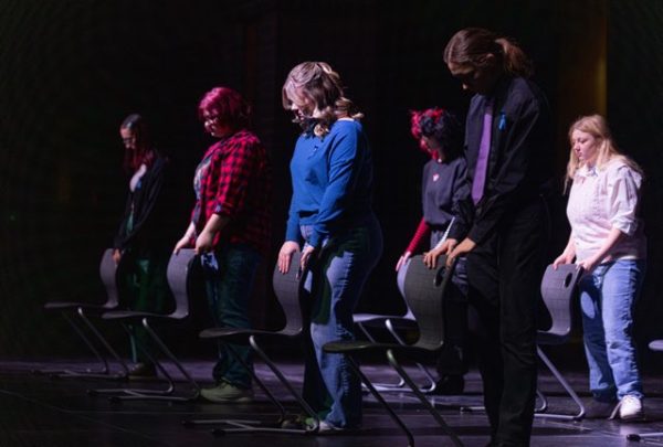 (left to right) Junior Alex Callaway, sophomore Piper Leber, junior Natalee Rojas and senior Andrew Schauer bow their heads during a transition scene for their production of “100 Things I Never Said to You” on Jan. 25. They had been preparing for the performance since the start of the school year. photo contributed by Piper Leber