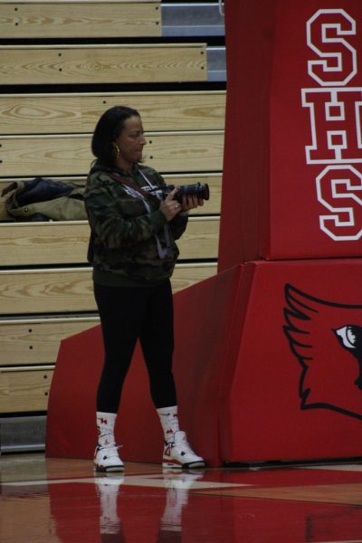  Junior Malakai Bravard's mother Megan Bravard films video courtside of the Roncalli game. The video she filmed was posted to her instagram Naptownmomhighlihgts. photo by Aiden Quinlin.