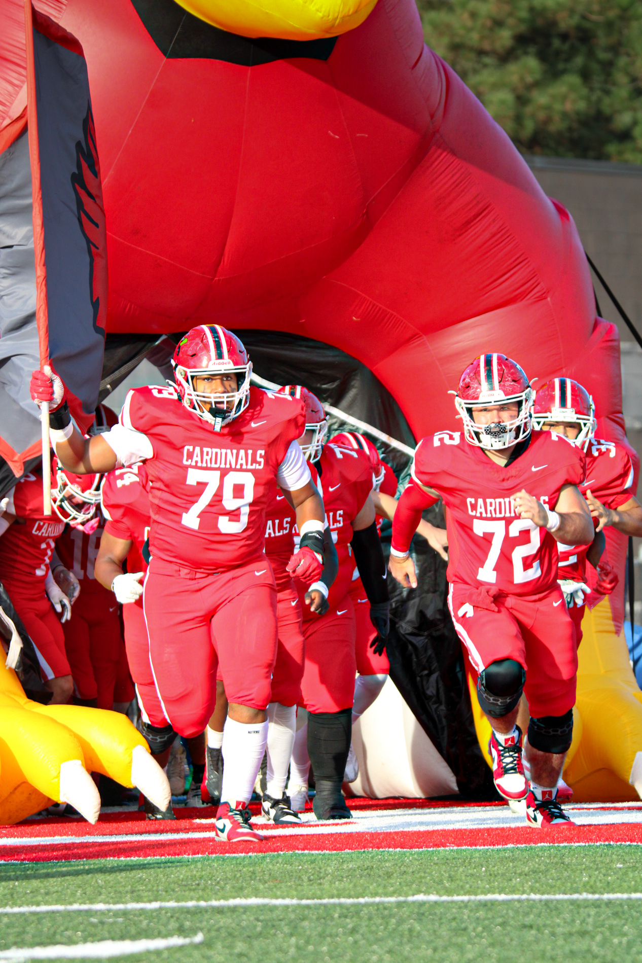 On Friday, Aug. 29. the Cards storm out of the cardinal tunnel preparing to face their rivals: the Perry Meridian High Falcons. The Cards fell against the Falcons 41-0, putting their record on the season to 0-2. (photo contributed by Aiden Quinlin)