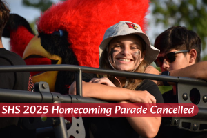 Alumna Hannah Mathews smiles at the camera while riding on the SHS booster club float.