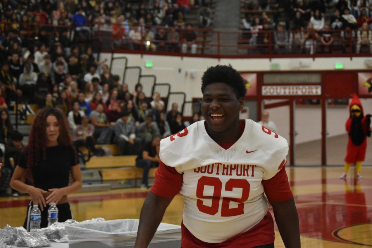 Moore ran excitedly towards his teammates and friends. He had just won the hot dog eating contest.