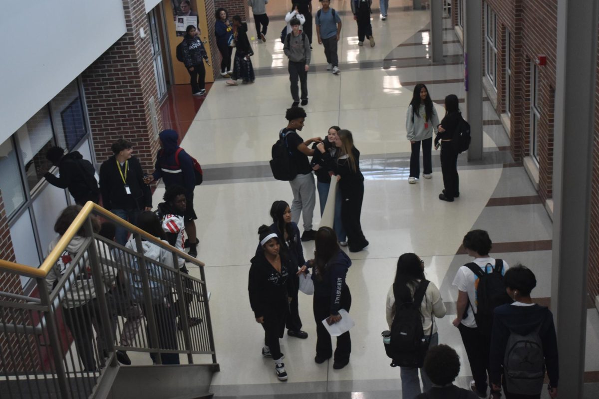 Students walk to their iPASS class. Students had five minutes to change from their original iPASS location to the iPASS class they signed up for. 