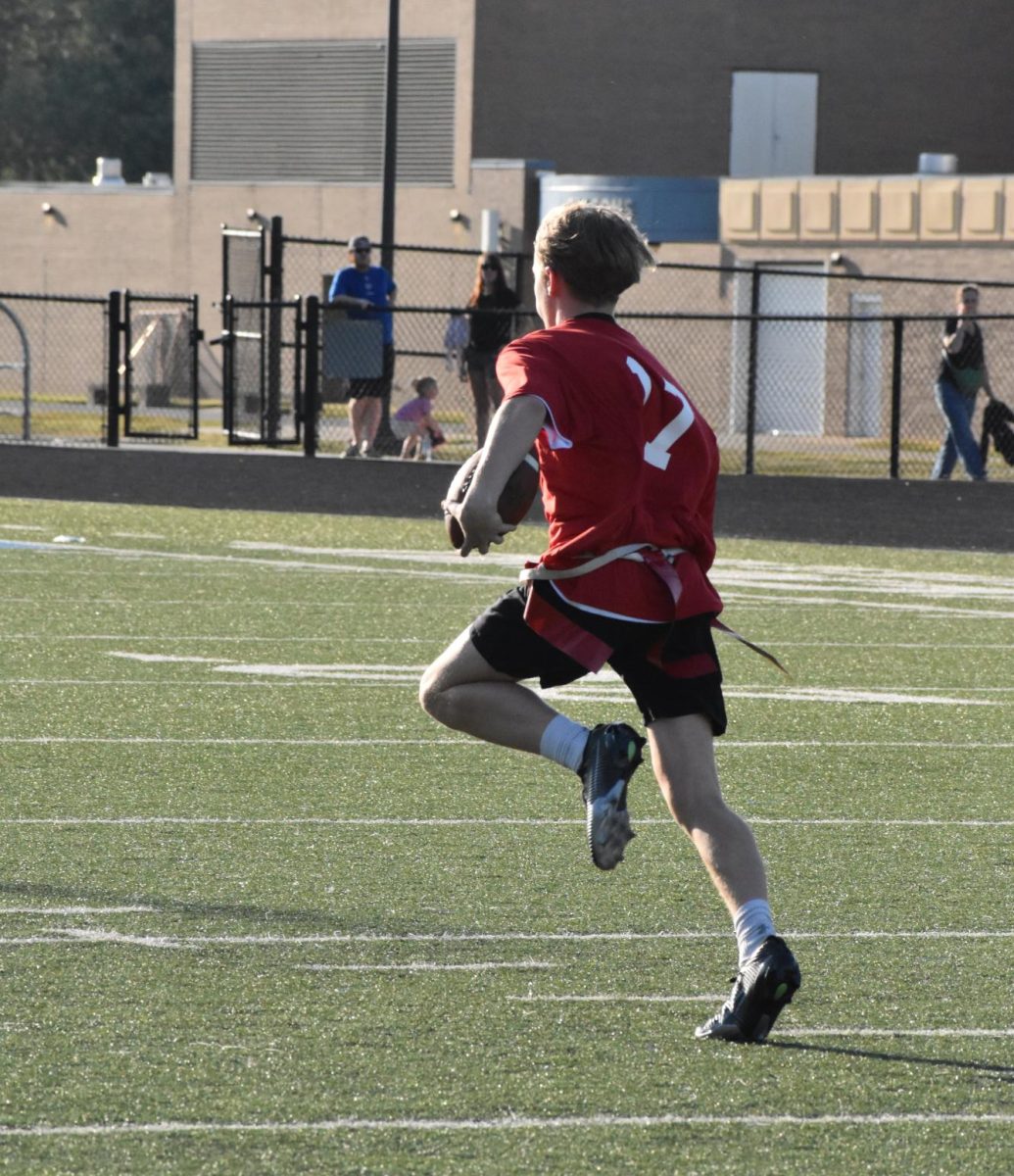 Bryant runs towards the endzone after receiving the ball with no defenders around. He scored a touchdown for his team.