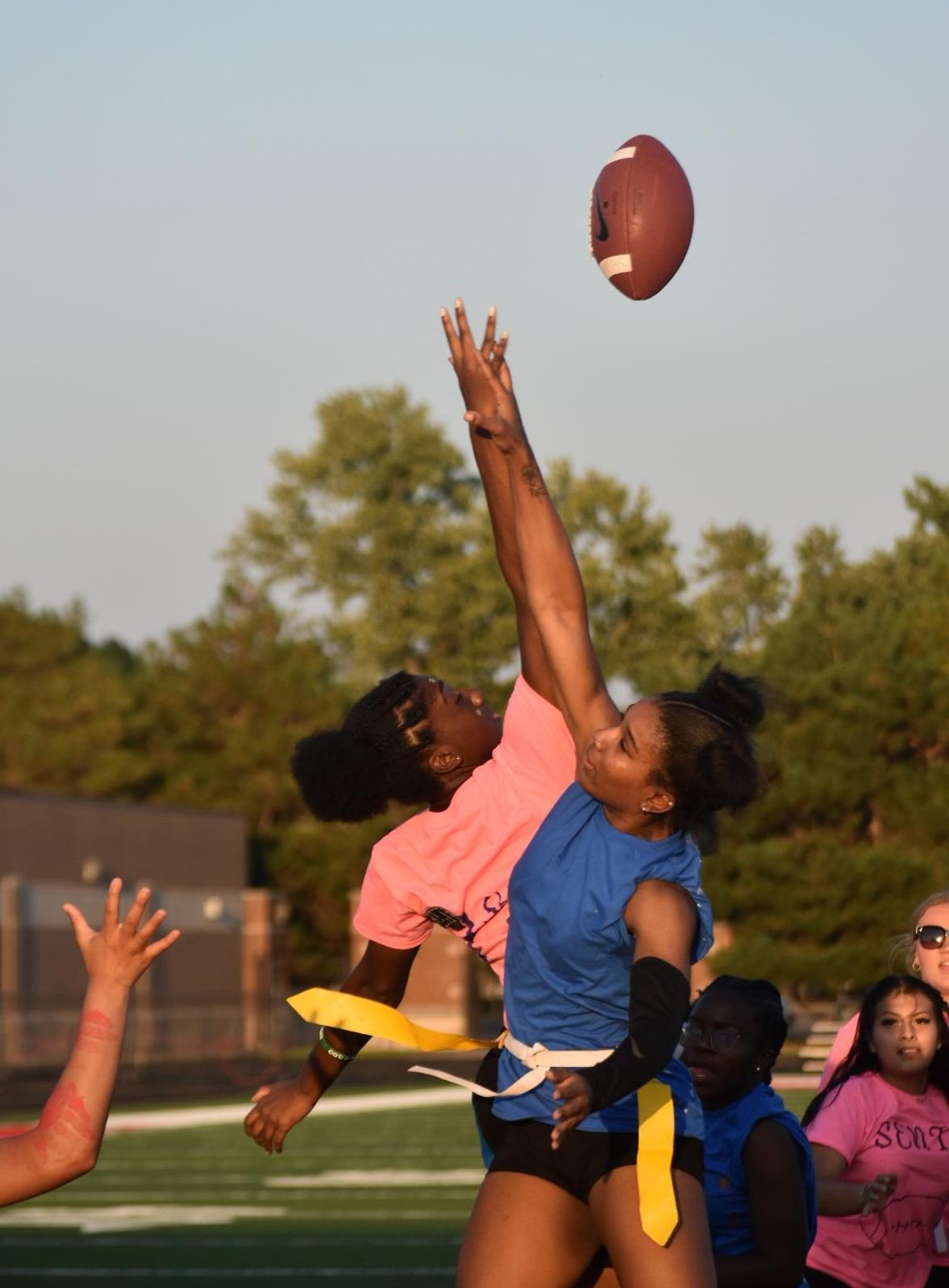 Senior Shakyra Maureedullah and junior Nevaeh Thomas both attempt to gain possession of the ball. Originally, the ball was intended for Maureedullah, but it was out of reach.
