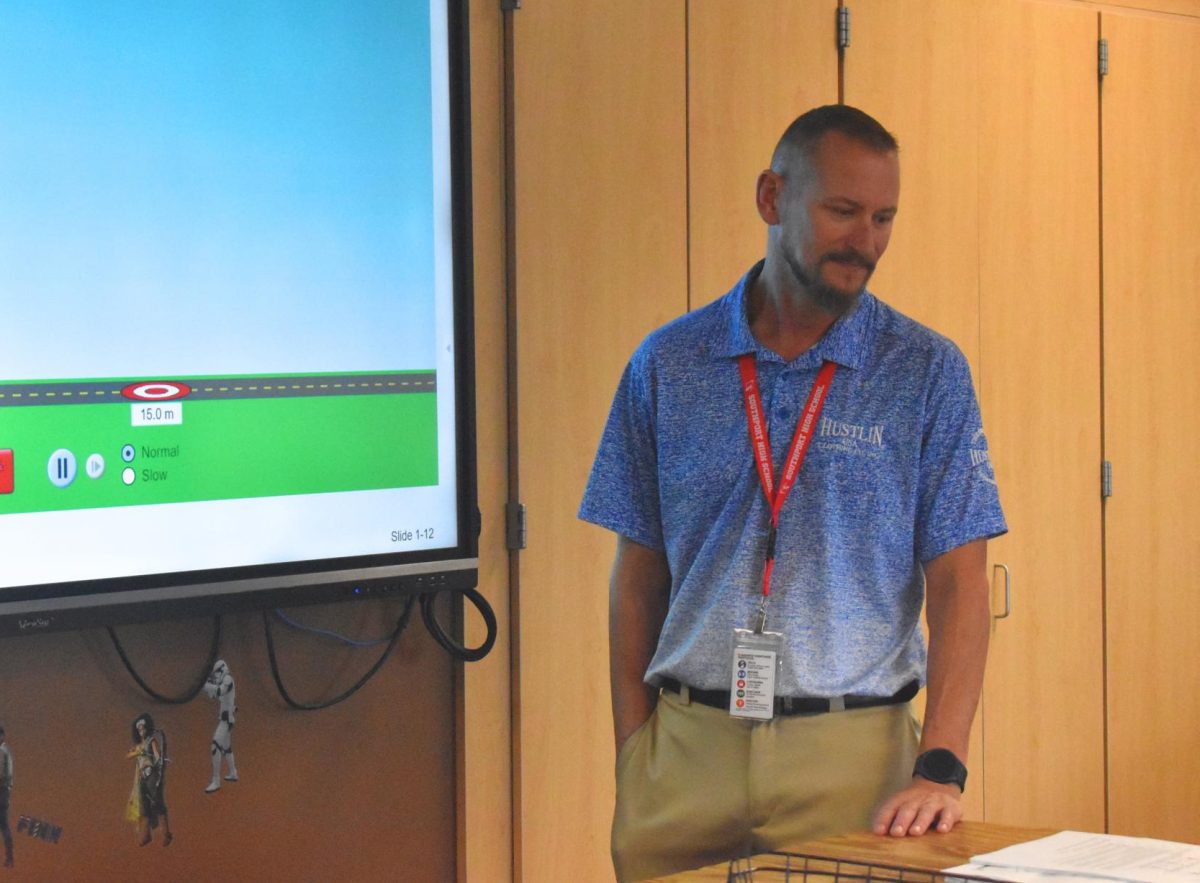Mr. Ritter observes a lesson in front of Mrs. Matlock's physics class on Sept. 23. He serves the role of Matlock's student teacher and assists students when needed.