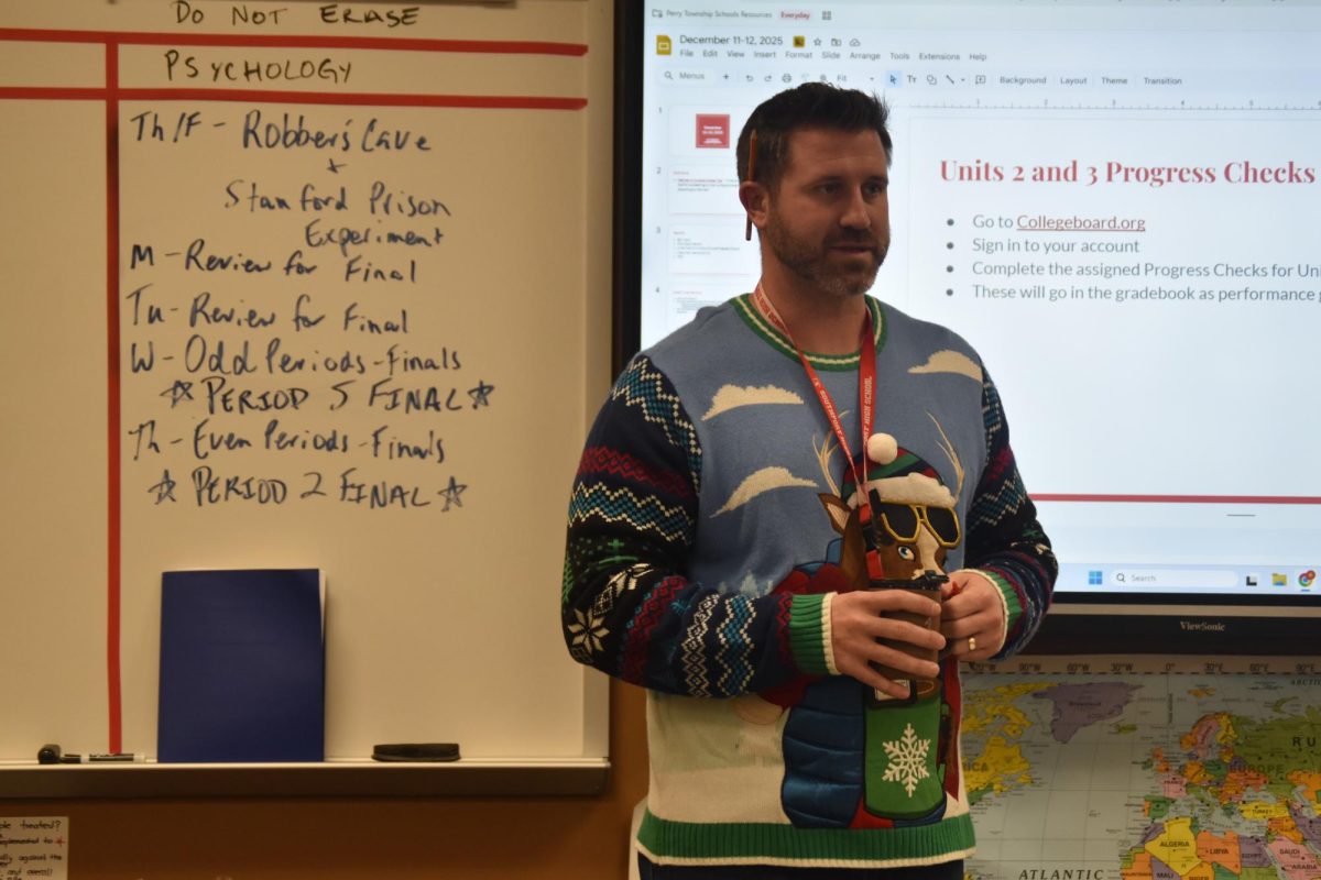 Social studies teacher Kenton Armbruster gives his class instructions on their assignment. Photo by Max Castro