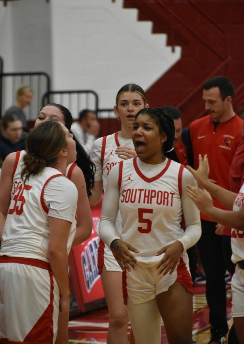 Junior Nevaeh Thomas and Bennett celebrate their victory. Bennett finished off the game with the ball in her hands, dribbling until the clock hit zero.