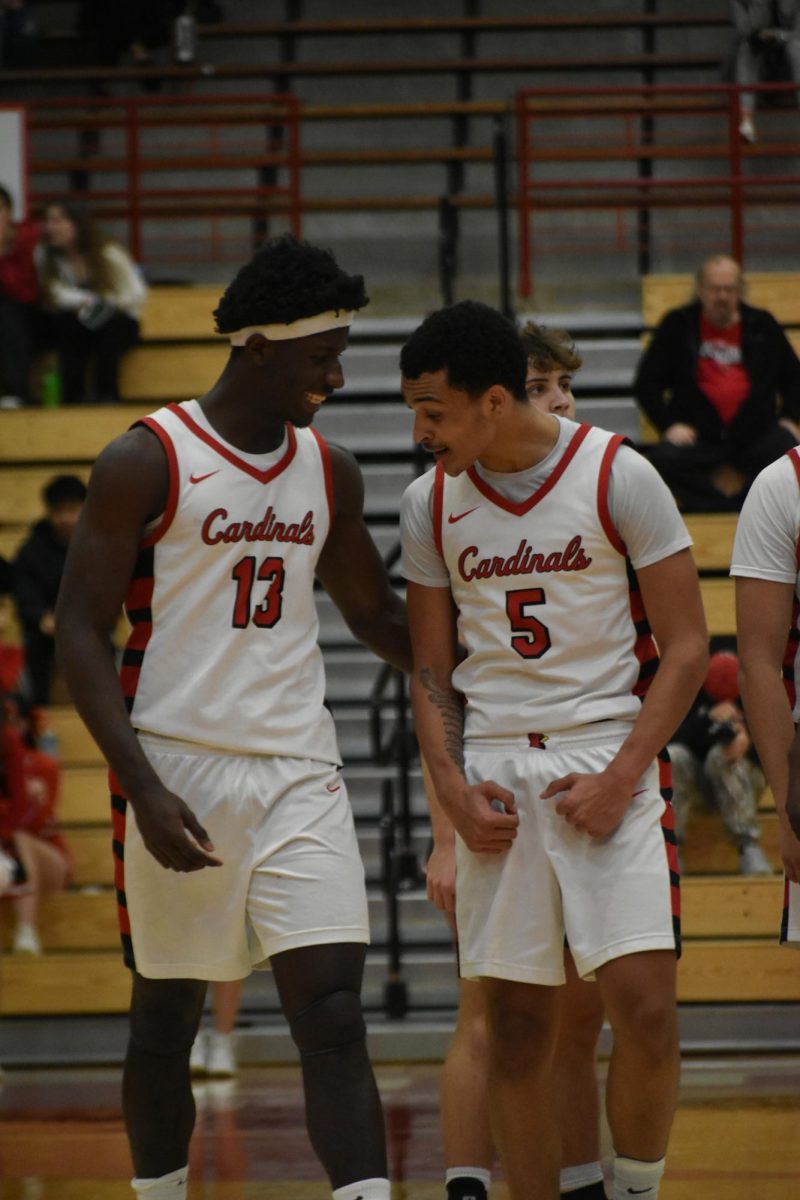 Senior Samuel Lloyd and junior Jonathan Fulce flex and congratulate each other after an "and one" play. The next possession, Fulce stole the ball, which resulted in a dunk. 