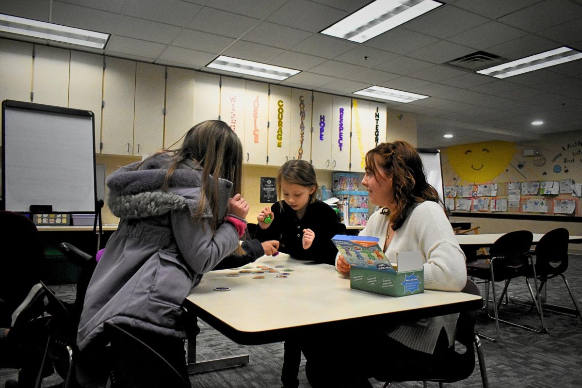 Senior Morgan Harmon engages in activities with second graders at Jeremiah Gray Elementary on Feb. 11. She goes four times a week to the elementary school as part of her cadet teaching class.