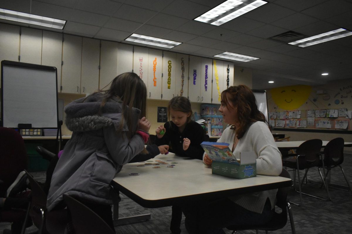 Senior Morgan Harmon engages in activities with second graders at Jeremiah Gray Elementary on Feb. 11. She goes four times a week to the elementary school as part of her cadet teaching class.