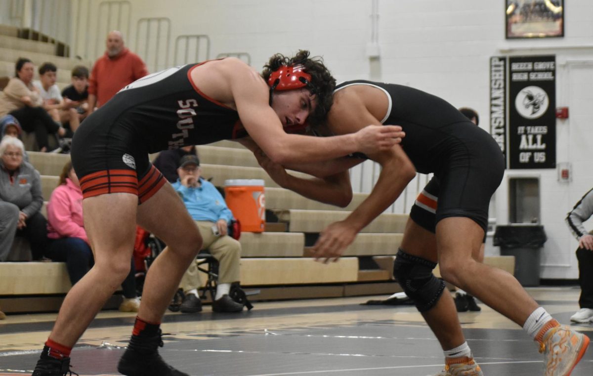 Junior Mason Lancaster-Lynch is in the neutral position against a Hornet on the other side. Lancaster-Lynch lost against his opponent.