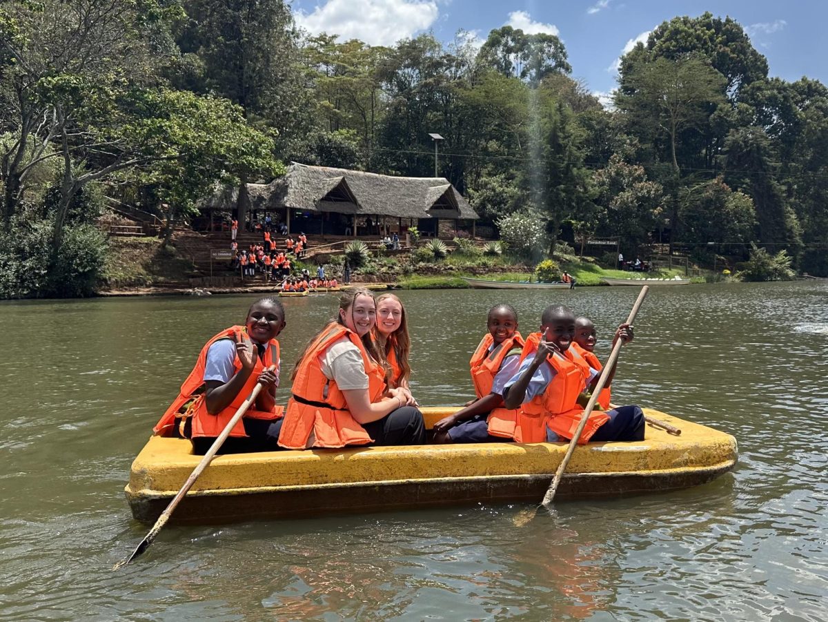 Senior Sonya Rees kayaks with kids from Kenya during her past mission trip last October. This was her second journey to Kenya and helped to spread faith to underprivileged kids. (Photo contributed by Rees)
