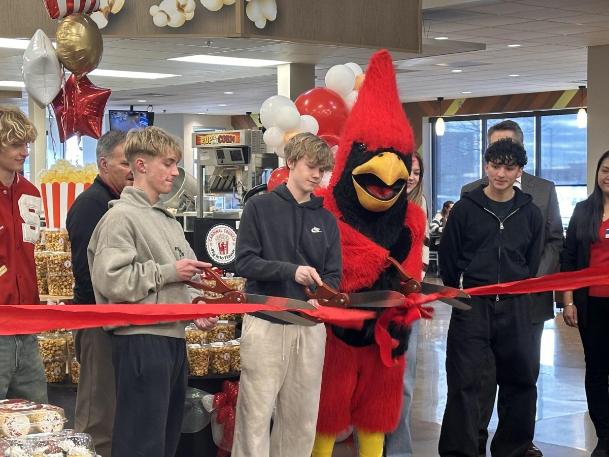 Marketing students cut the ribbon to Cardinal Crunch's debut at Kroger on Jan. 15.