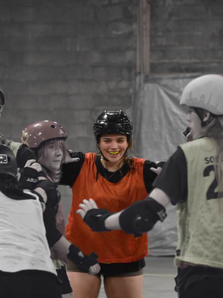 Junior Katelyn Strader smiles as she waits for the scrimmage to begin. She was a blocker during this time.