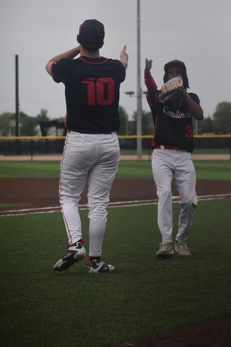 Senior Miles Caudill and Duncan do a dance before getting in their starting positions. 