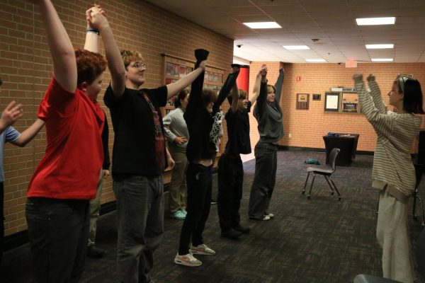 SMS middle school students learn how to bow properly. Sophomore Beau Kellams and Brooklyn Deckard also subbed in for missing students.