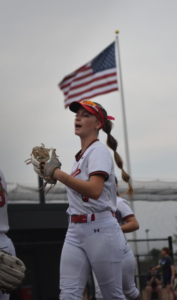 Kiefner runs to the huddle from shortstop. Kiefner is one of three team captains.